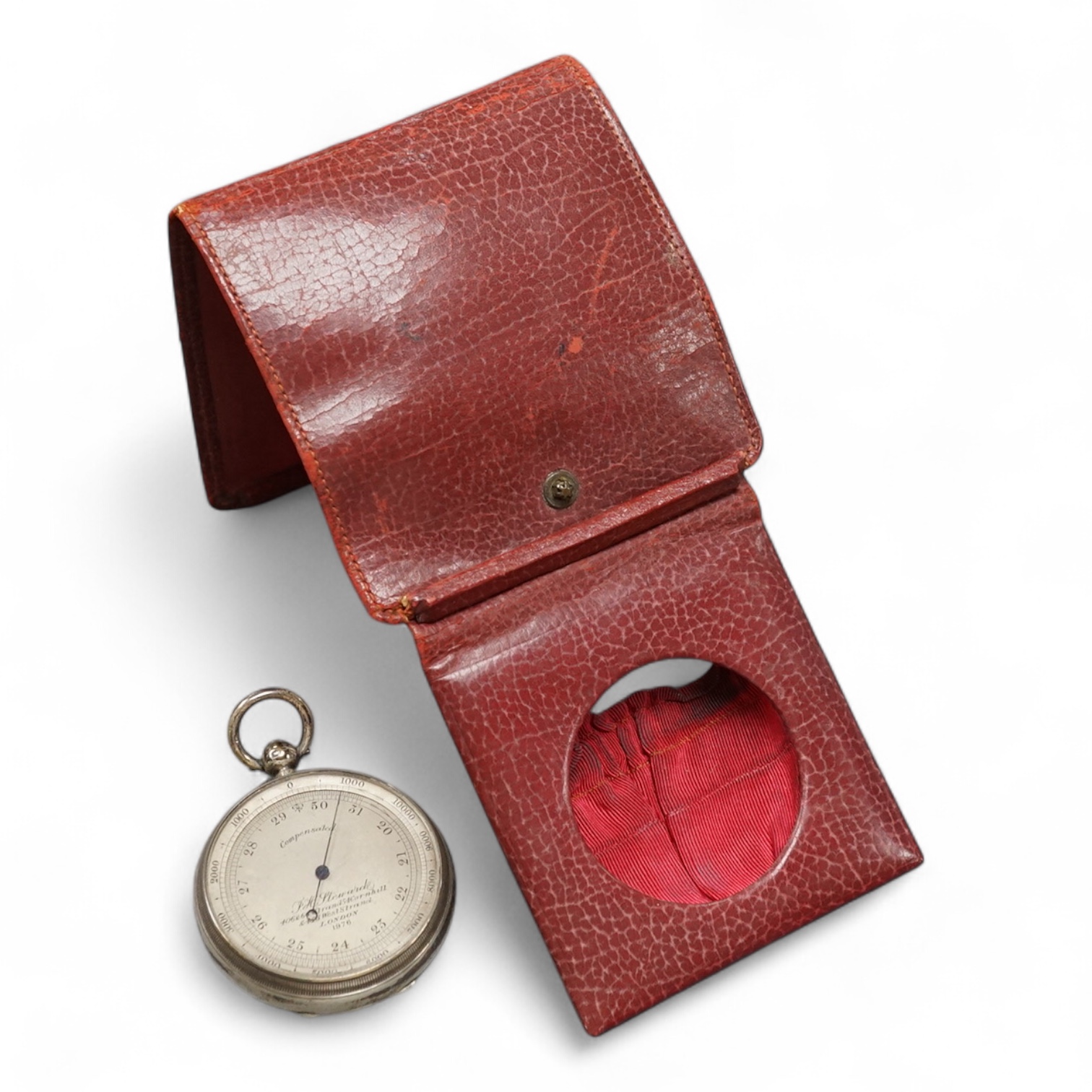 A late Victorian silver cased pocket barometer, by James Thomas White, London, 1881, retailed by P.H. Steward of London, diameter 49mm, in leather case. Condition - fair